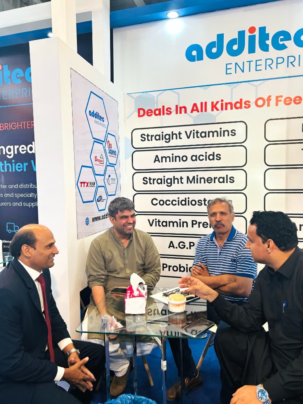 Visitors reviewing Additec feed ingredient category boards at IPEX EXPO 2026