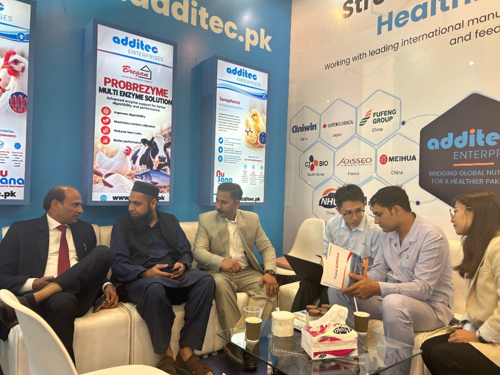 Group discussion at the Additec Enterprises exhibition stand