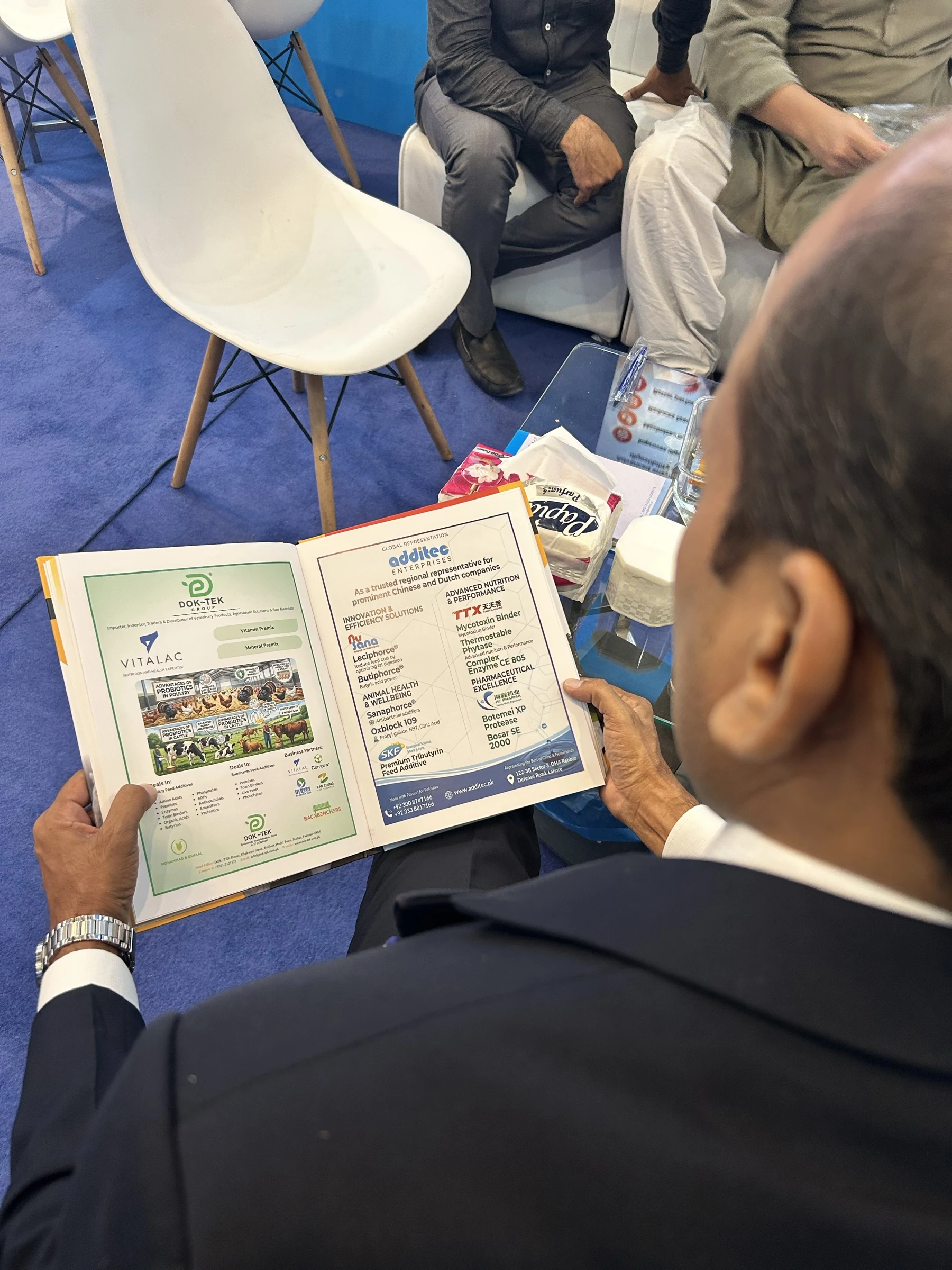 Printed materials being reviewed at the Additec Enterprises exhibition stand