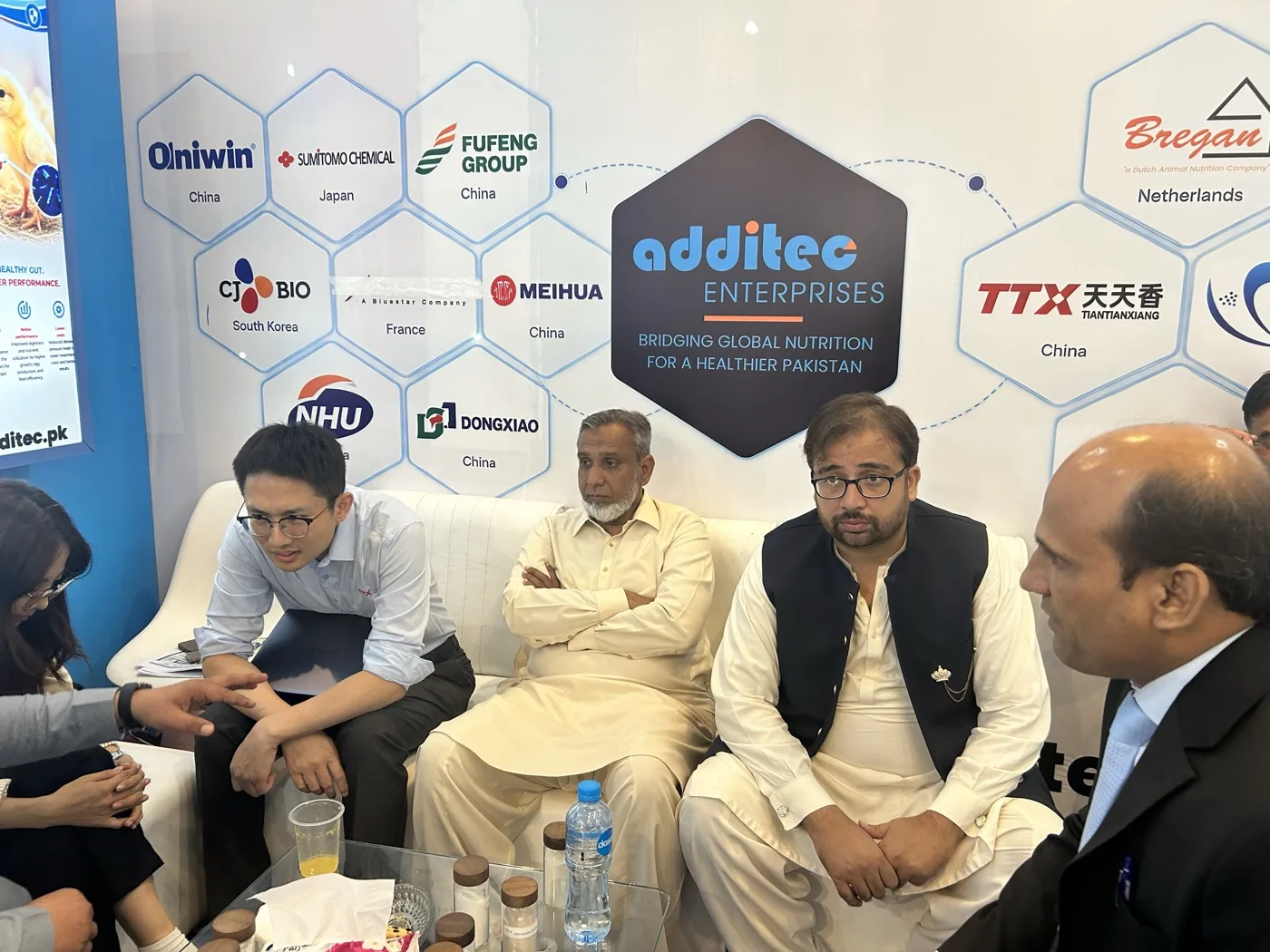 Business discussion at the Additec Enterprises IPEX EXPO stall