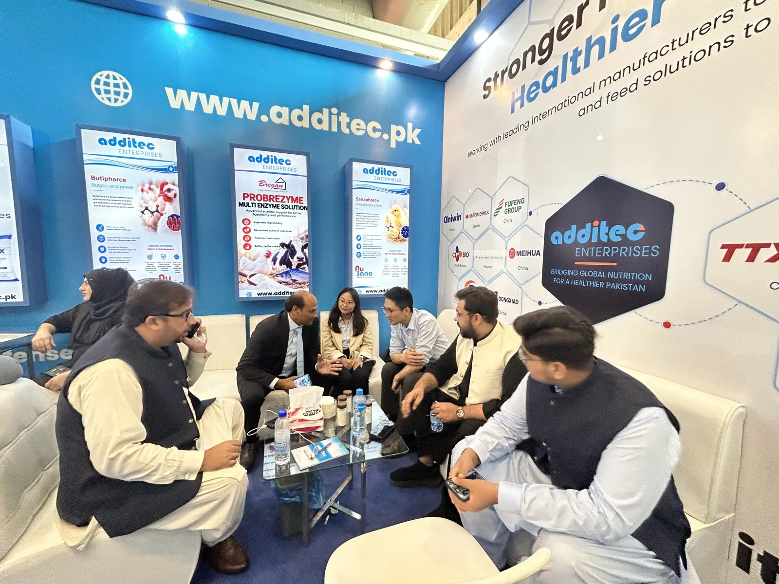 Visitors meeting inside the Additec Enterprises exhibition stall at IPEX EXPO 2026 Lahore
