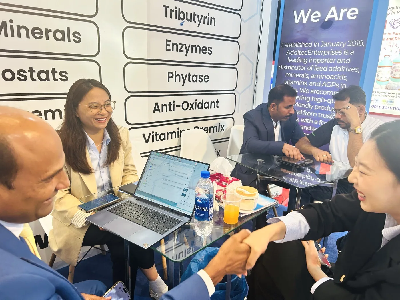Networking handshake at the Additec Enterprises exhibition stall